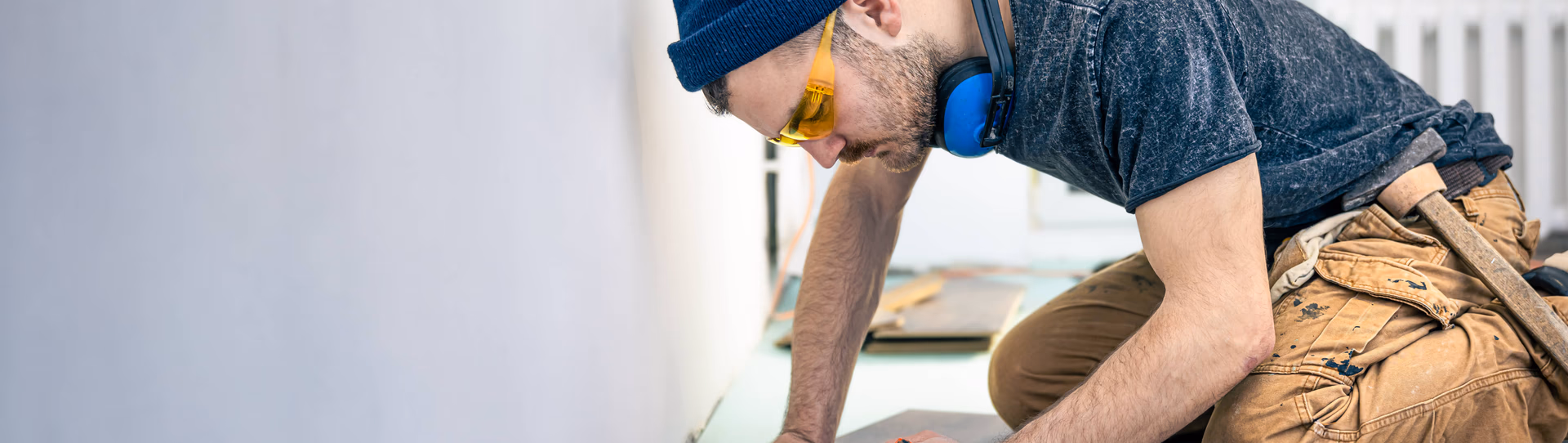 man working on a floor repair